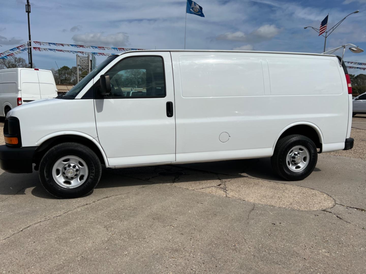 2013 White /Gray Chevrolet Express (1GCWGFCA0D1) with an 4.8 V8 engine, Automatic transmission, located at 4520 Airline Hwy, Baton Rouge, LA, 70805, (225) 357-1497, 30.509325, -91.145432 - 2013 Chevy Express 2500 Cargo Van 4.8 V8 Gas, 250K Miles, Power Windows & Locks. NO IN HOUSE FINANCING. FOR INFO PLEASE CONTACT JEFF AT 225 357-1497 CHECK OUT OUR A+ RATING WITH THE BETTER BUSINESS BUREAU WE HAVE BEEN A FAMILY OWNED AND OPERATED BUSINESS AT THE SAME LOCATION FOR OVER 45 YEARS. WE S - Photo#1